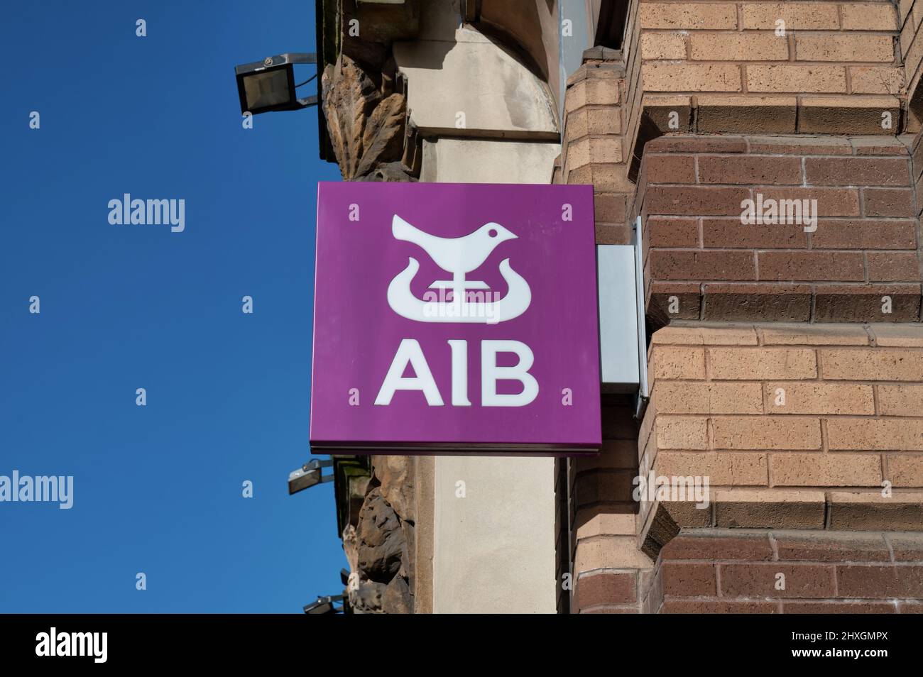Belfast, UK- Feb 19, 2022: The sign for AIB in Belfast Northern Ireland. Stock Photo