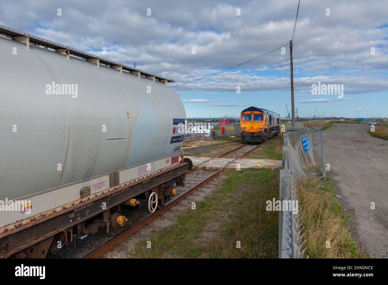 A GB Railfreigtht class 66 locomotive at North Blyth Alumina import terminal coupling up to a freight train carrying imported Alumina Stock Photo