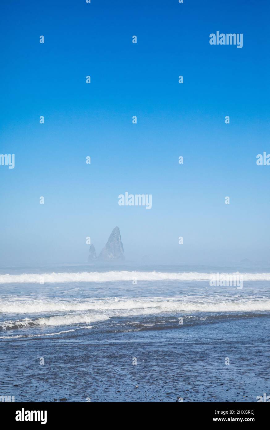 Rock pinacles and ocean waves as the fog clears on the Olympic National Marine preserve and Olympic National Park coastal strip, Washington, USA. Stock Photo