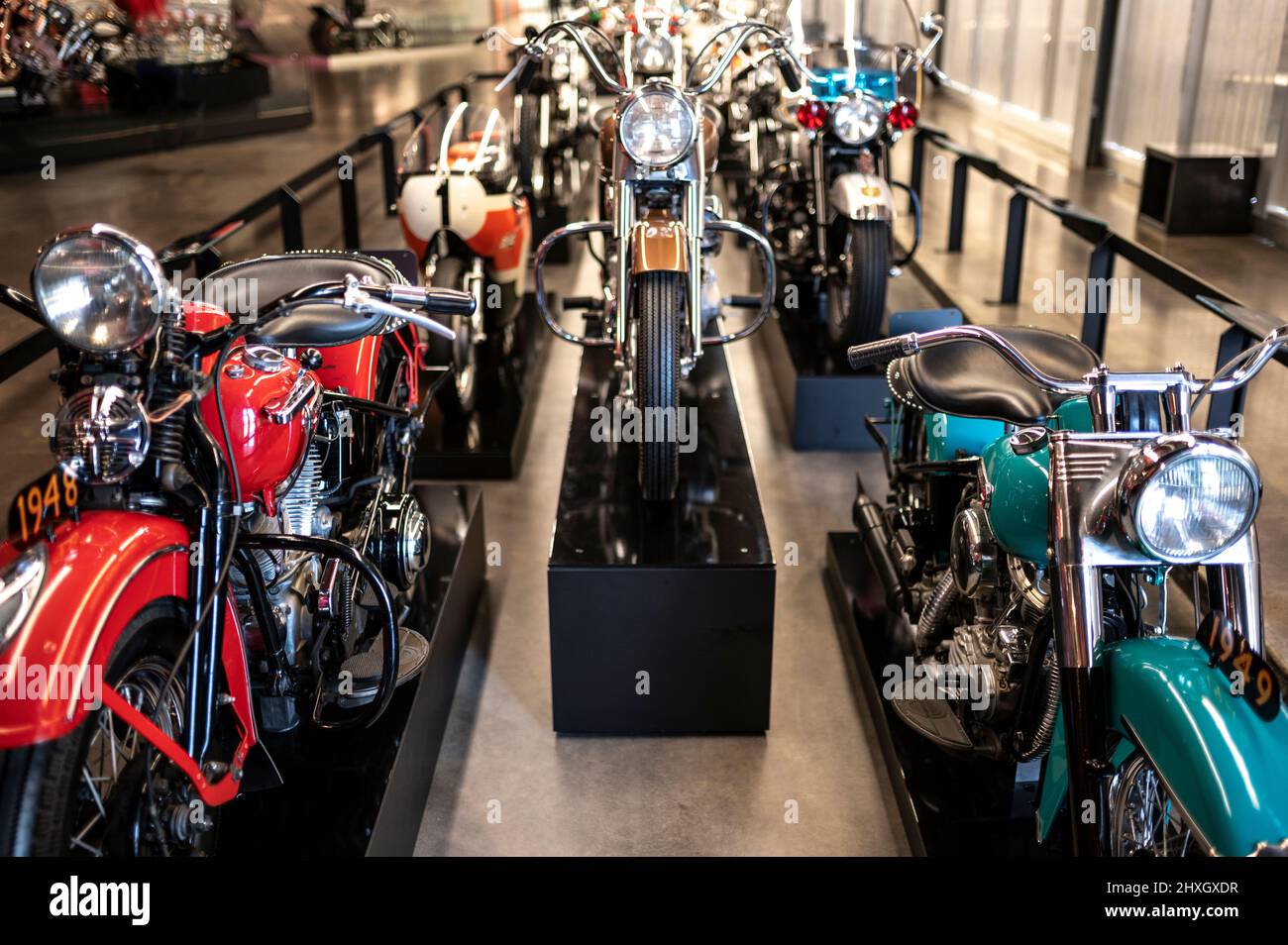 line of Harley-Davidson motocyles built over the years located at the Harley-Davidson museum in Milwaukee, Wisconsin, USA Stock Photo