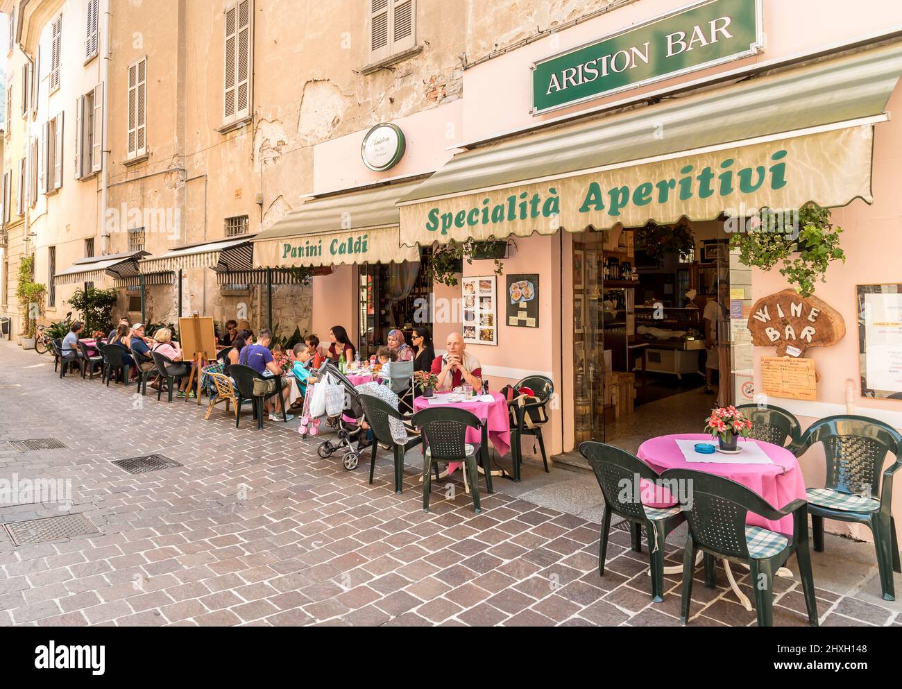 Como, Lombardy, Italy July 19, 2016 People enjoying a street wine