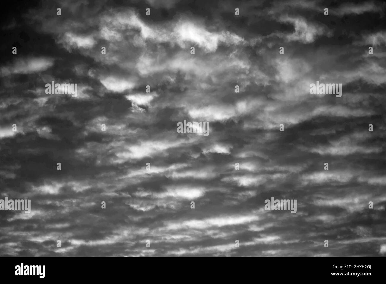 Altocumulus perlucidus with dramatic sky at sunset Stock Photo