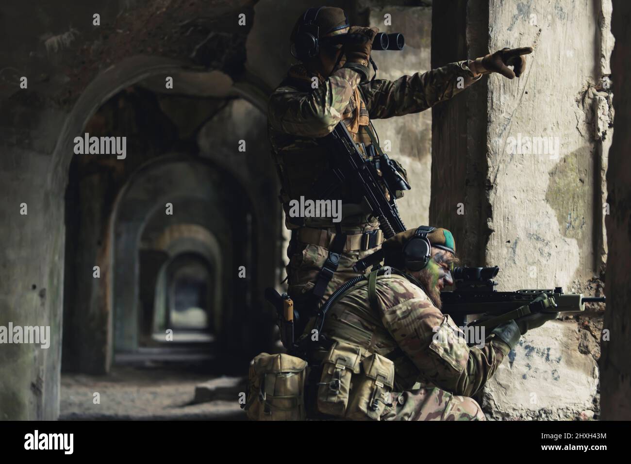 Pointing towards enemy position coordinates as a team. High quality photo Stock Photo