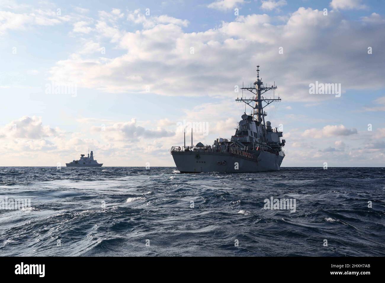 220307-N-UN585-2033 MEDITERRANEAN SEA (March 7, 2022) The French ship FS Forbin (D 620), left, and the Arleigh Burke-class guided-missile destroyer USS Ross (DDG 71), transit the Mediterranean Sea, March 7, 2022. Ross, forward-deployed to Rota, Spain, is on its 12th patrol in the U.S. Sixth Fleet area of operations in support of regional allies and partners and U.S. national security interests in Europe and Africa. (U.S. Navy photo by Mass Communication Specialist 2nd Class Claire DuBois/Released) Stock Photo