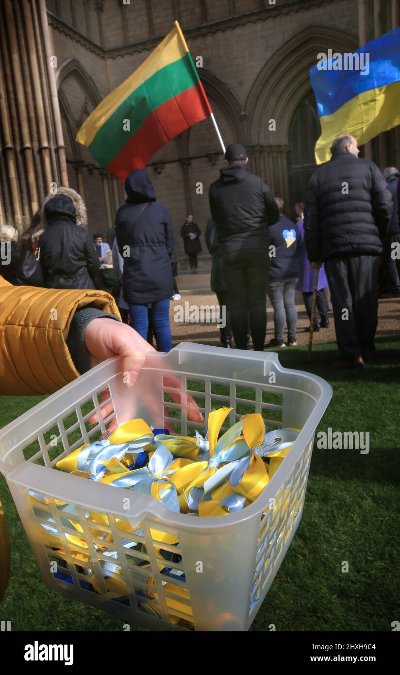 Ukraine Ribbon Support Peterborough, UK. 12th Mar, 2022. Ukrainian support ribbons are passed ...