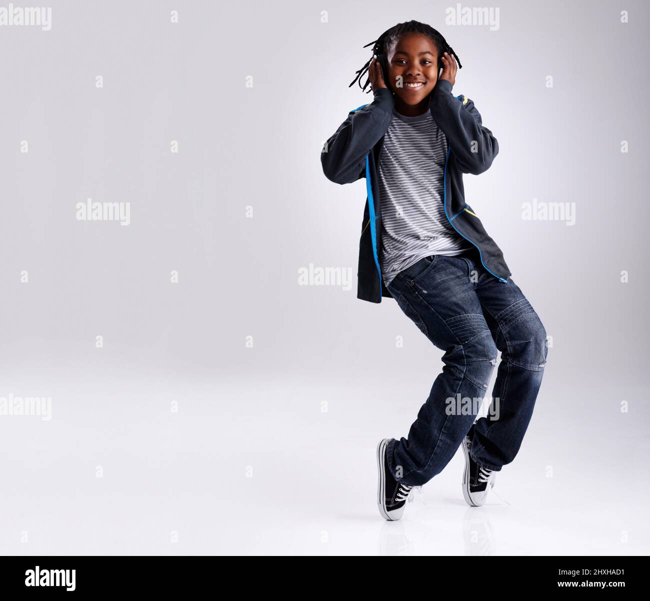 Young male hip hop dancer posing on grey background - Stock Image -  Everypixel