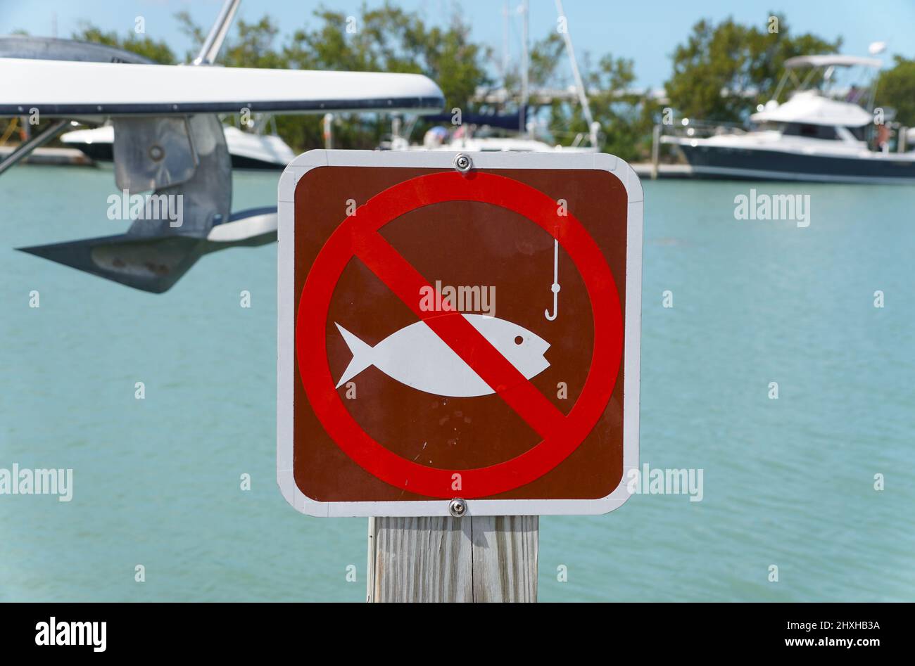 Big Pine Key, Florida, U.S - February 20, 2022 - The sign to alert visitors that no fishing is allowed by the boat dock at Bahia Honda State Park Stock Photo