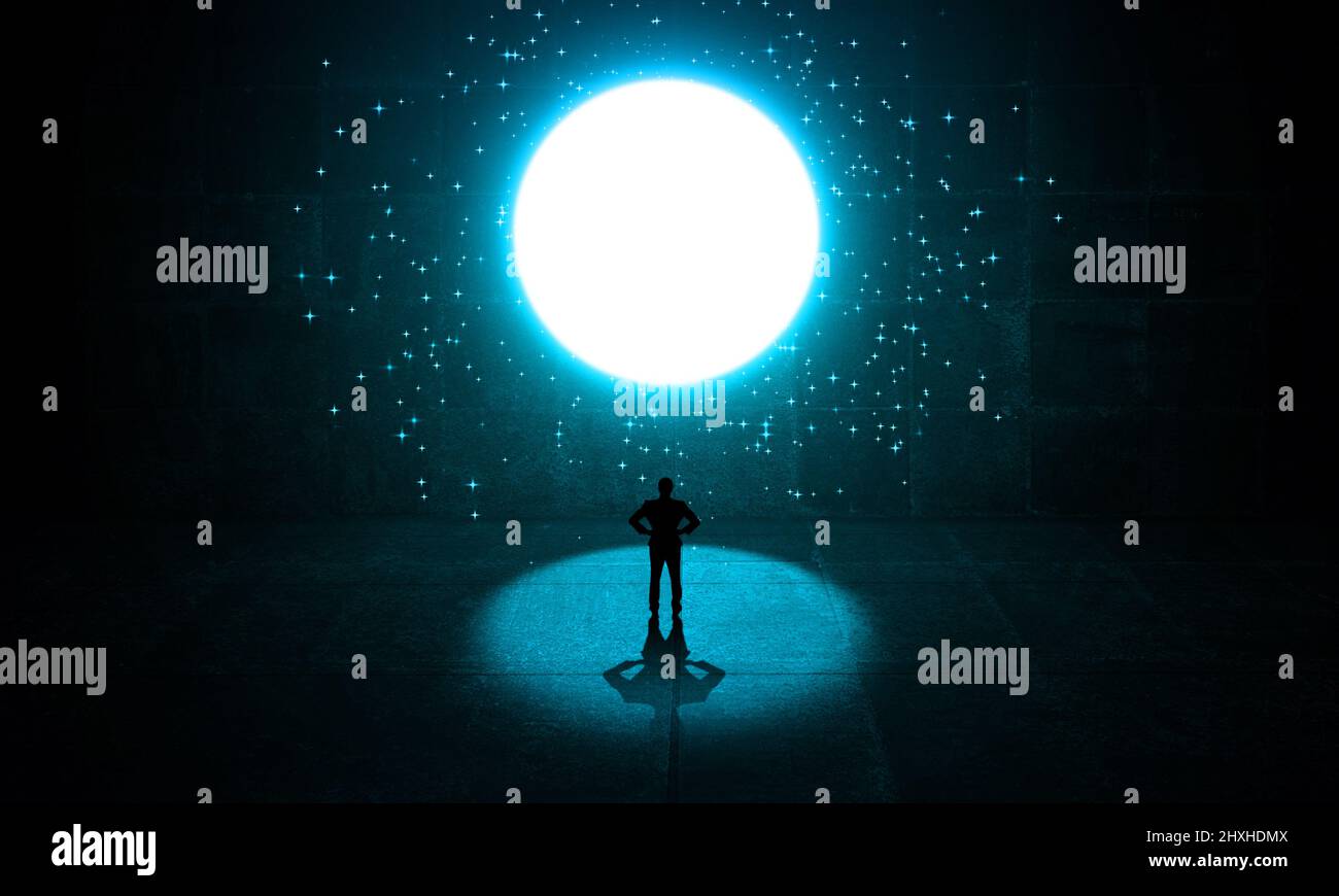Businessman Standing in a spot light from a starry bright circle window or exit. Business man thinking in getting out from a dark concrete room. Imagi Stock Photo