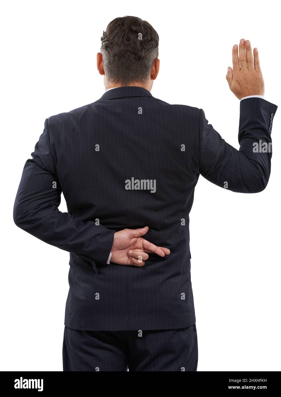 Politicians honour. Rearview of a mature man swearing an oath with his fingers crossed behind his back. Stock Photo