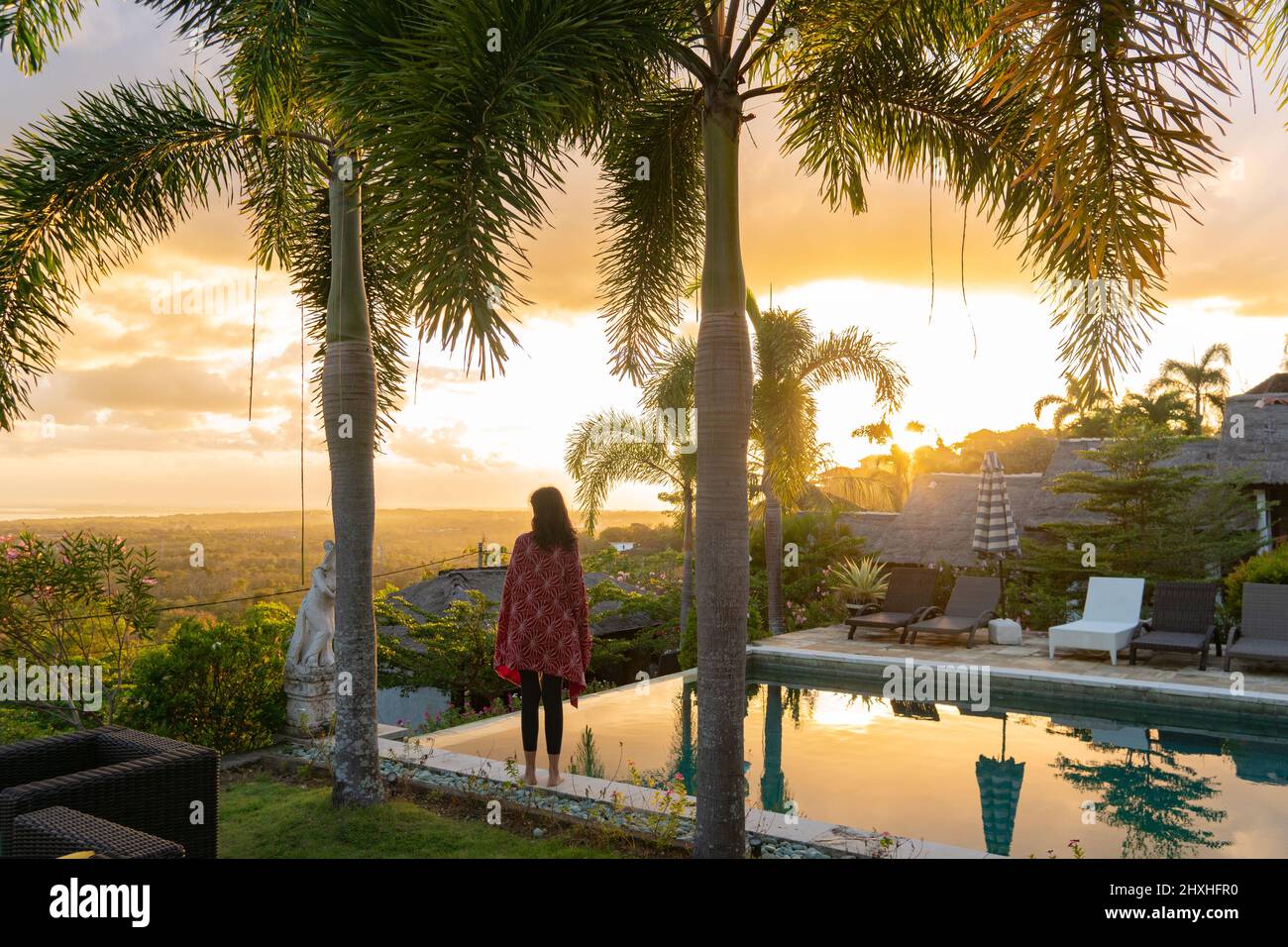 Beautiful young woman watching sunrise hi-res stock photography and ...