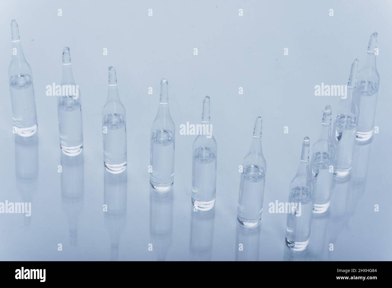 Glass medical ampoule vial for injection. Medicine is dry white drug ...