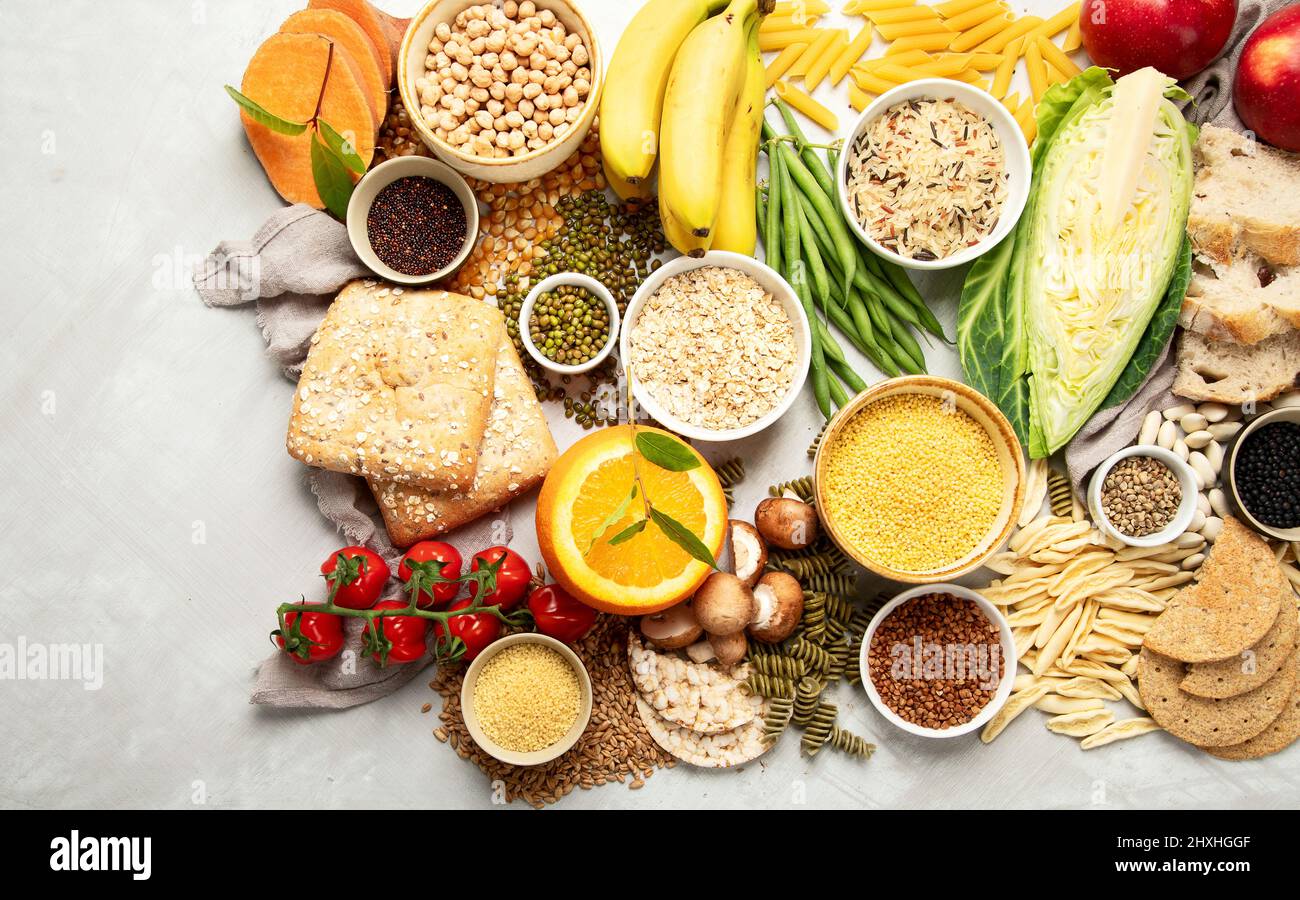 Selection of good carbohydrates sources vegetables, fruits, grains, legumes, nuts and seeds on