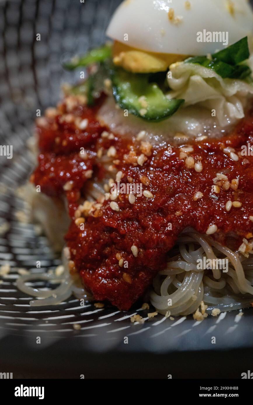 Korean cold noodles in the bowl, closeup shot. Stock Photo