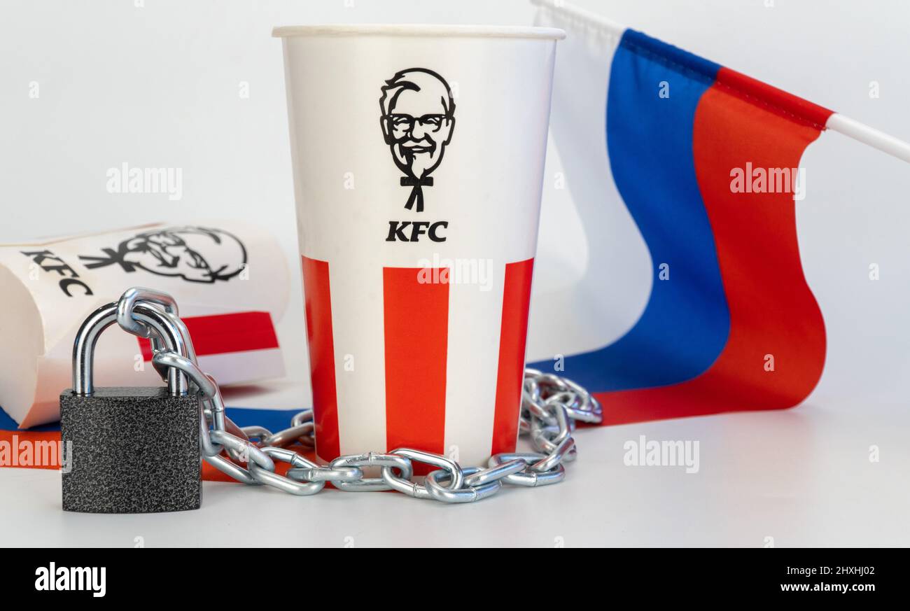 Russia, Krasnoyarsk, March 2022: KFC products with iron chain and padlock.  Stock Photo