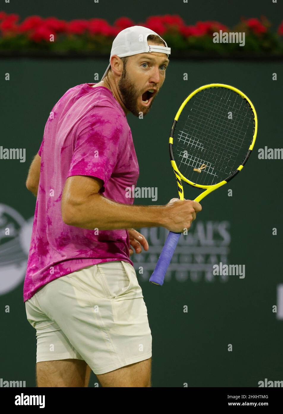 March 12, 2022 Jack Sock reacts to winning a point against Stefanos  Tsitsipas of Greece during the 2022 BNP Paribas Open at Indian Wells Tennis  Garden in Indian Wells, California. Mandatory Photo