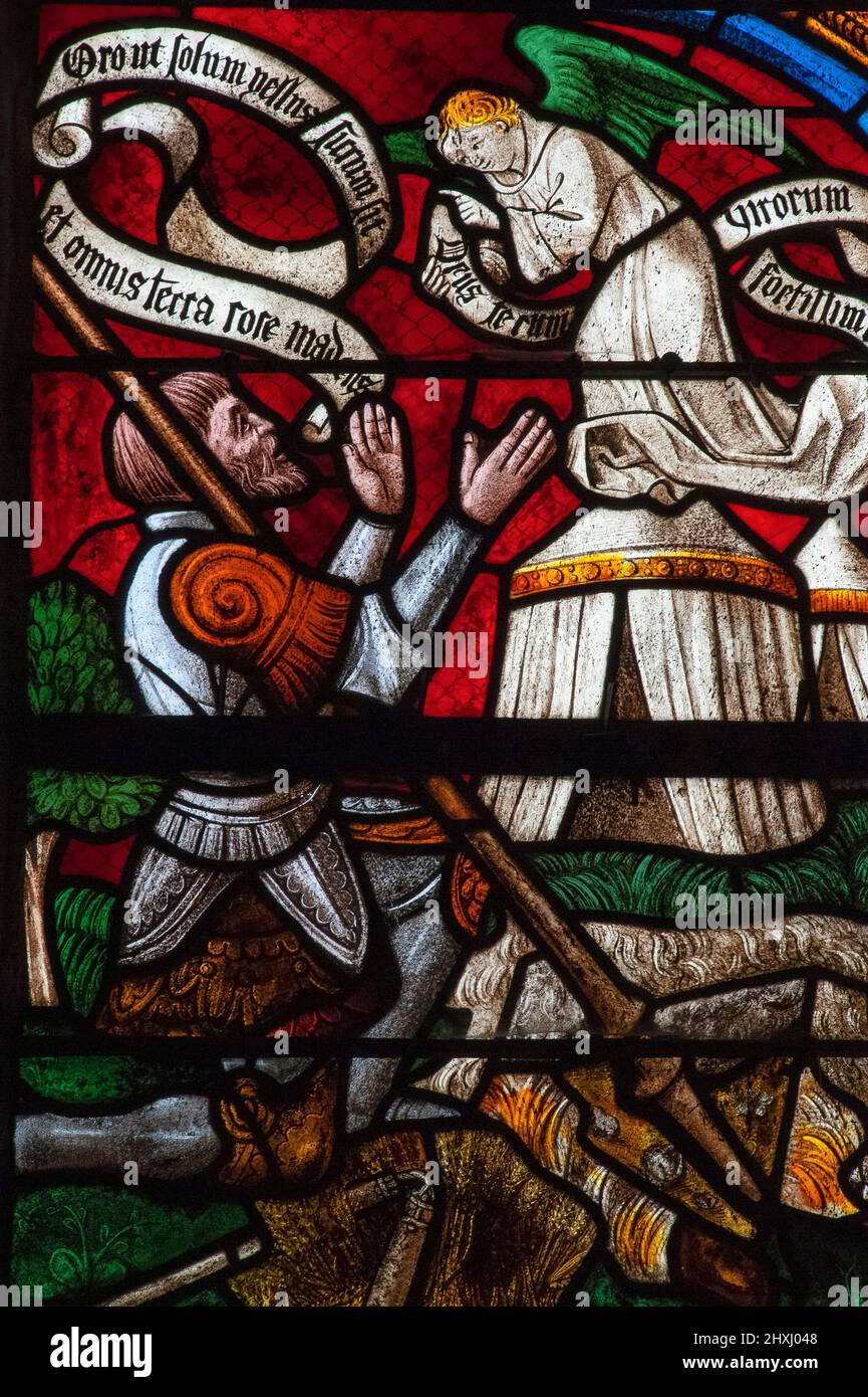 Angelic messenger from God appears to armoured Israelite leader Gideon in a panel of the Tree of Jesse stained glass window by the master glassmakers of Troyes installed in 1512 in the Église Saint-Rémi, the parish church at Ceffonds, Haute-Marne, Grand Est, France. Stock Photo
