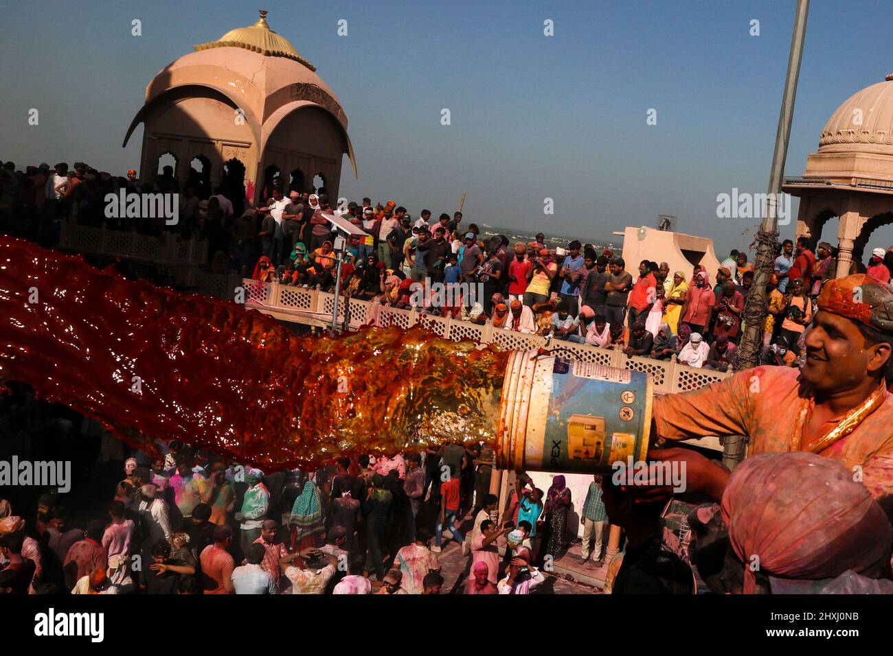 Uttar Pradesh, New Delhi, India. 12th Mar, 2022. A Hindu devotee throws colored water at a temple during ''Lathmar Holi'', in Nandgaon. (Credit Image: © Karma Sonam Bhutia/ZUMA Press Wire) Stock Photo