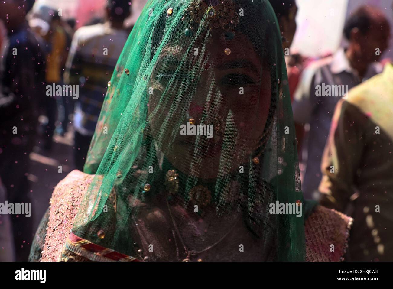Uttar Pradesh, New Delhi, India. 12th Mar, 2022. A Hindu devotee with her face daubed in colors takes part in ''Lathmar Holi'', in Nandgaon. (Credit Image: © Karma Sonam Bhutia/ZUMA Press Wire) Stock Photo