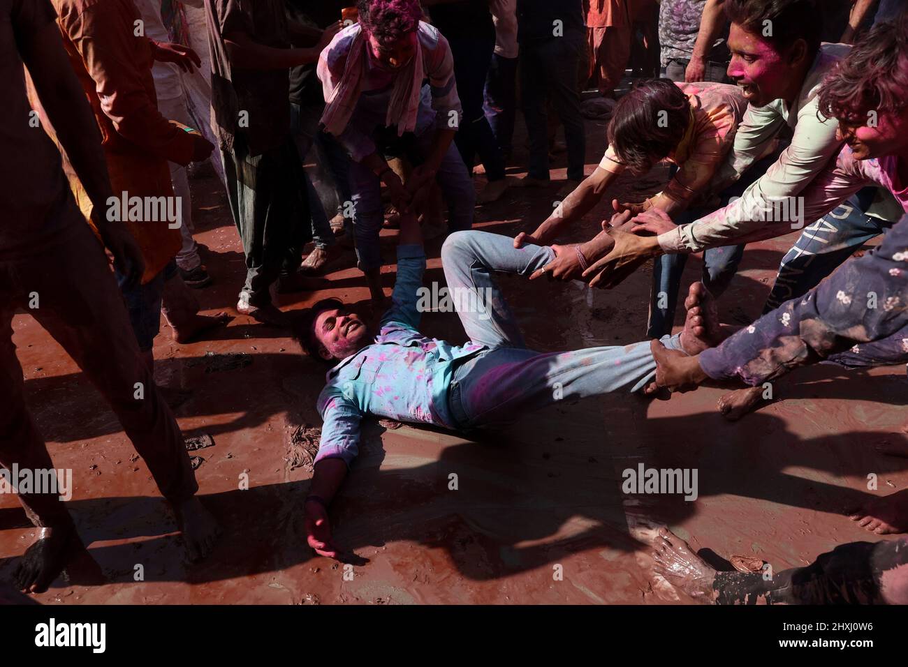 Uttar Pradesh, New Delhi, India. 12th Mar, 2022. Hindu devotees daubed in colors take part in the religious festival of ''Lathmar Holi'', in the town of Nandgaon. (Credit Image: © Karma Sonam Bhutia/ZUMA Press Wire) Stock Photo