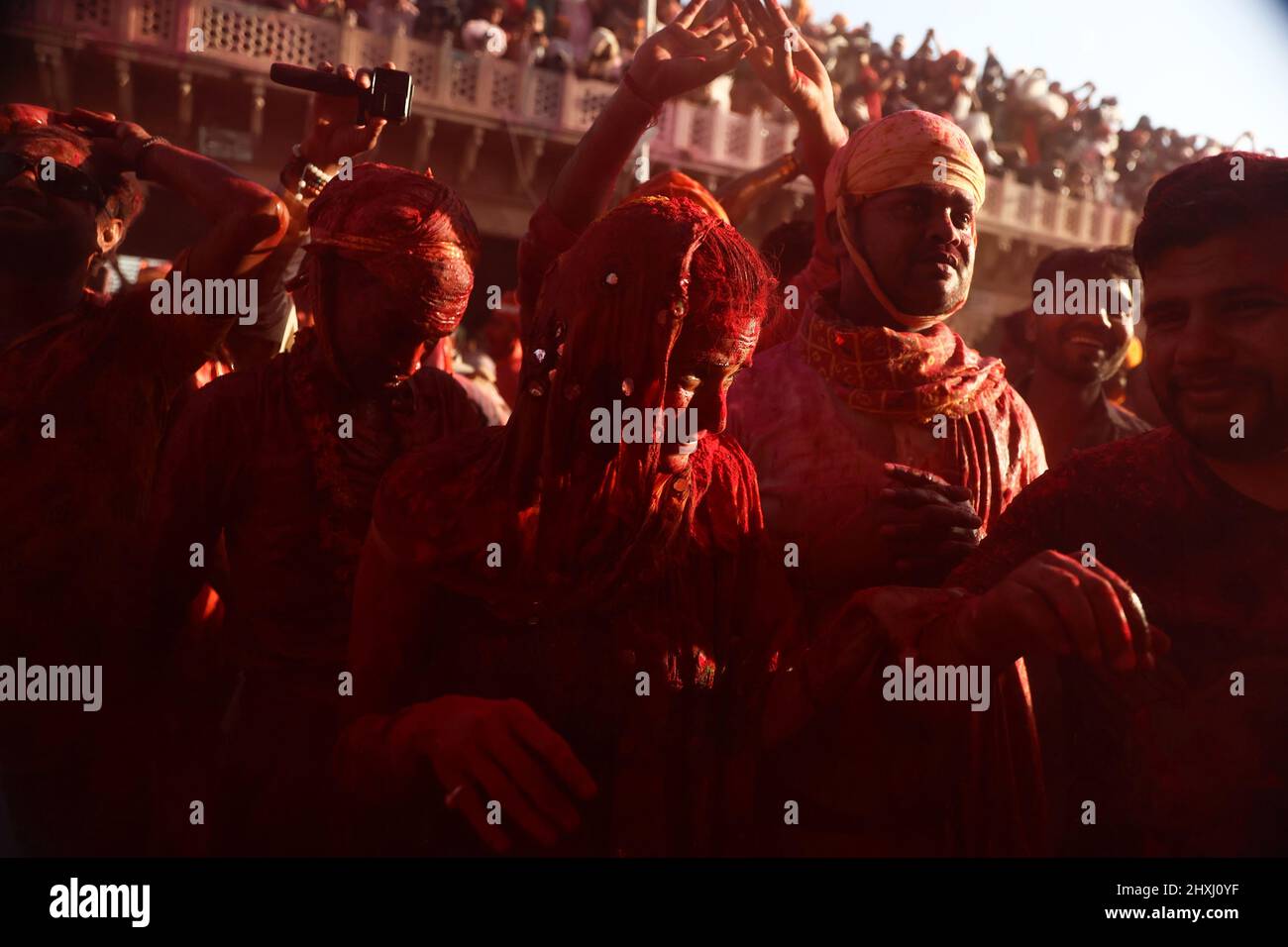 Uttar Pradesh, New Delhi, India. 12th Mar, 2022. Hindu devotees daubed in colors take part in the religious festival of ''Lathmar Holi'', in the town of Nandgaon. (Credit Image: © Karma Sonam Bhutia/ZUMA Press Wire) Stock Photo