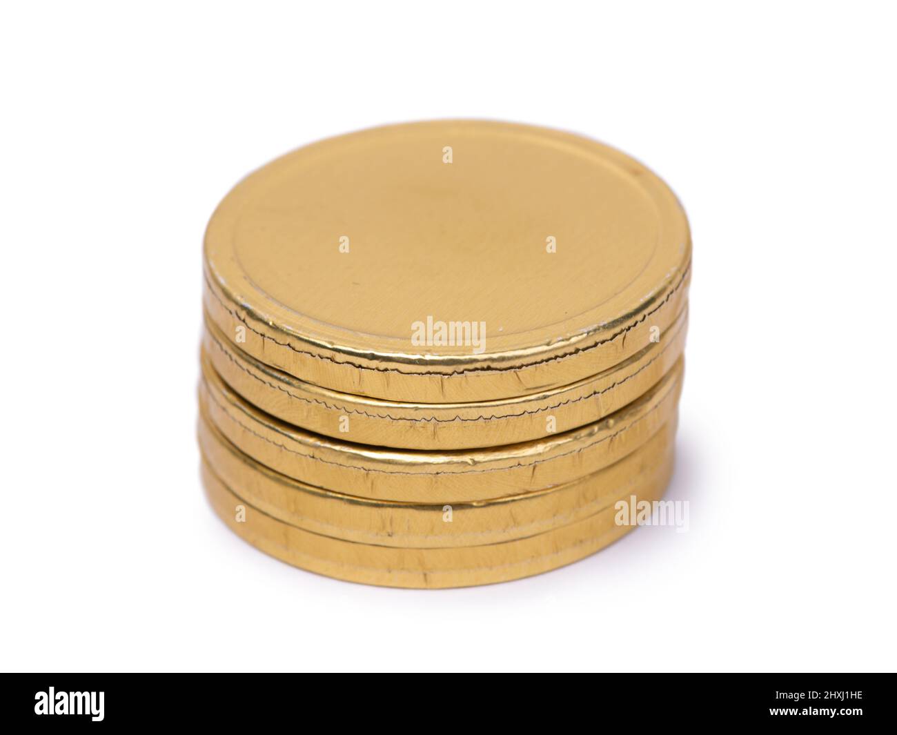 Chocolate candies in the form of coins in golden foil isolated over white background Stock Photo