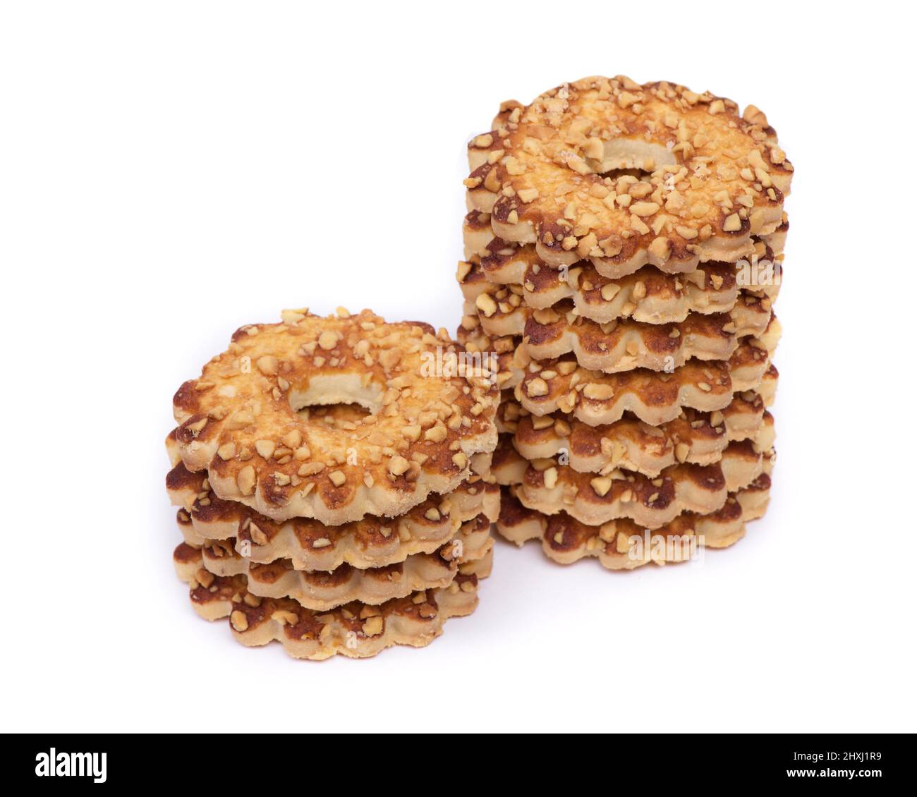 Stack of cookies with peanuts isolated on white background Stock Photo