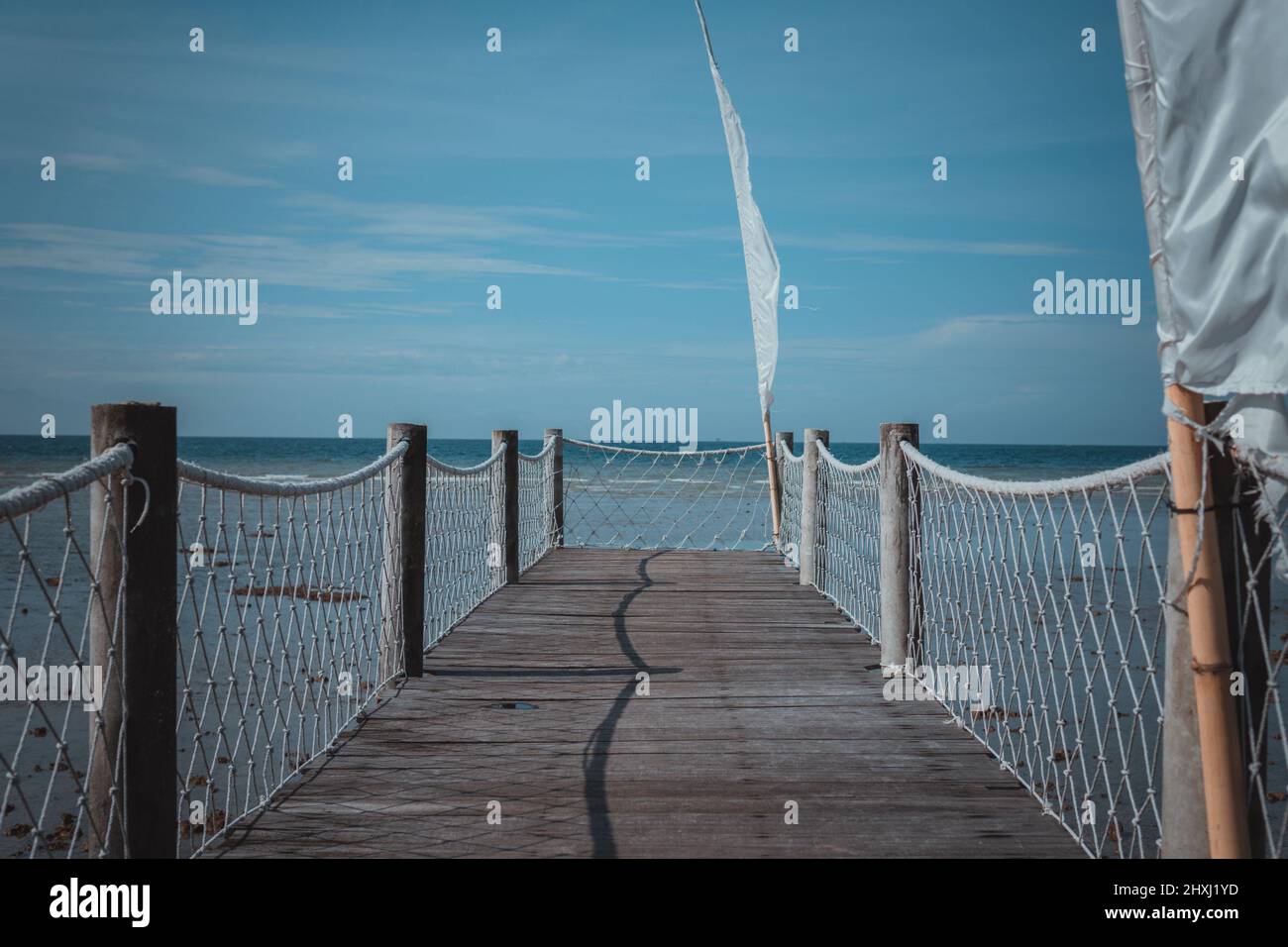 The bridge over the sea made of wood in one of the restaurants in