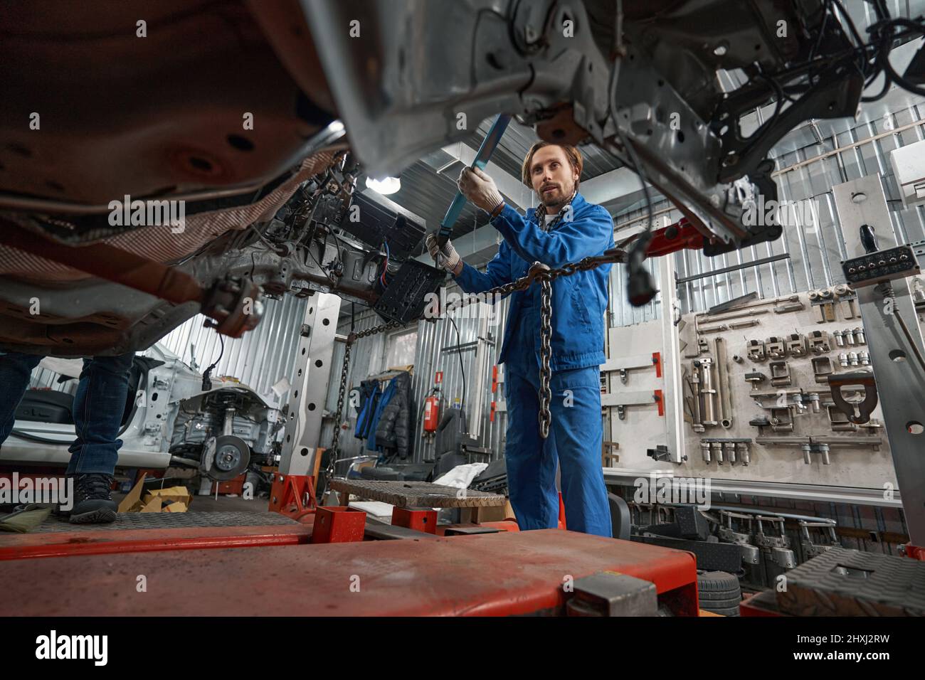 Man holding special tool for auto repair Stock Photo Alamy