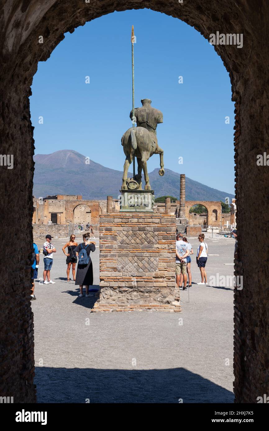 People at Pompeii Forum with statue of the Centaur in Campania, Italy. Stock Photo