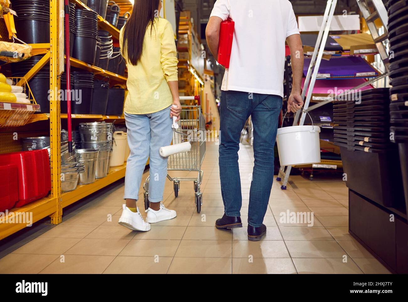 Man carrying paint bucket walking hires stock photography and images