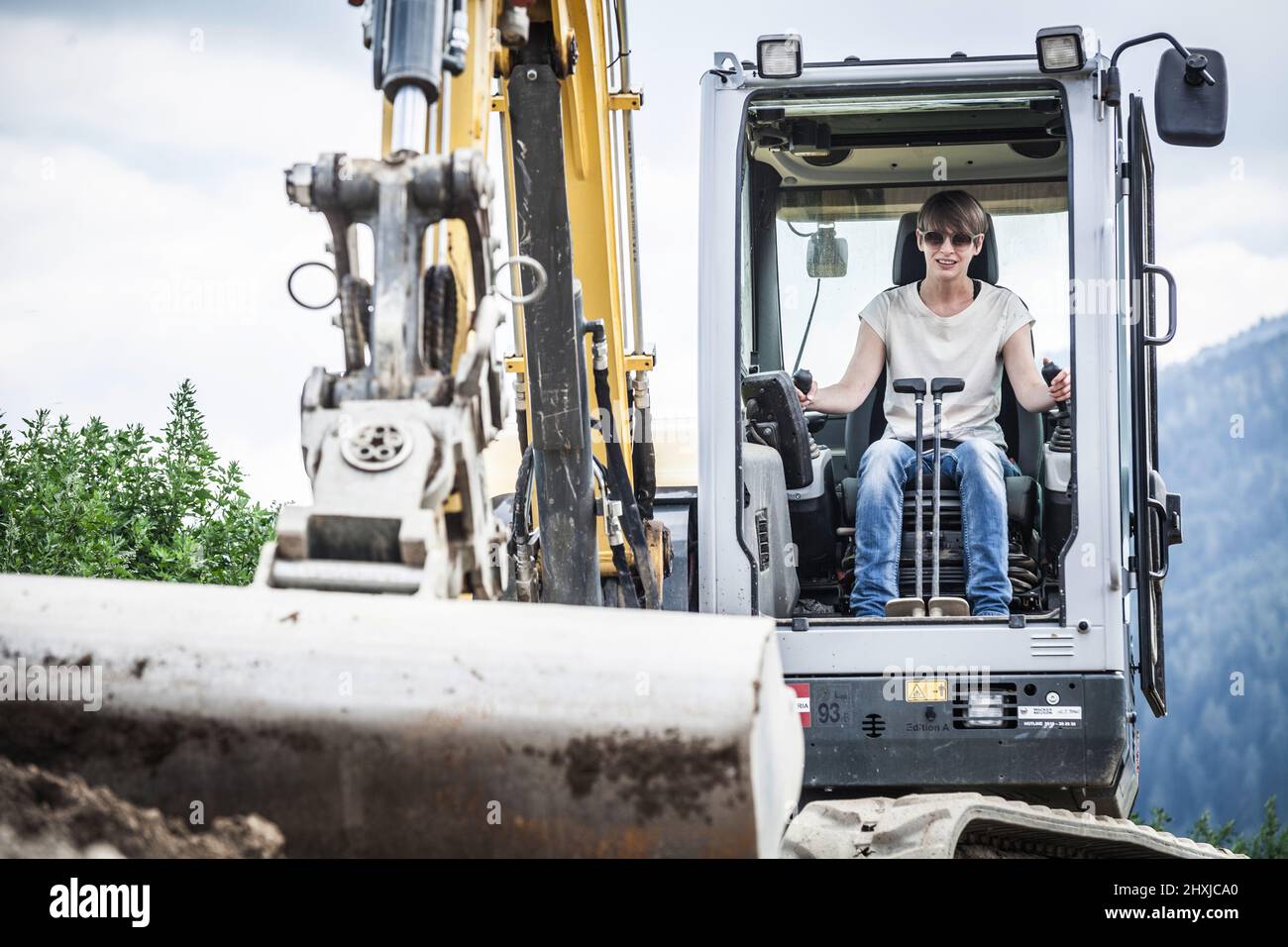female excavator driver at work Stock Photo