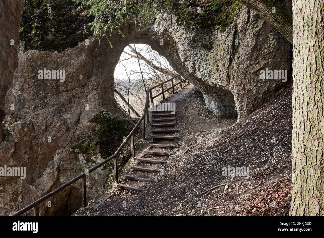 Hiking trail through rock tunnel at Klosterfelsenweg near Inzigkofen Princely Park, Upper Danube Nature Park, Germany Stock Photo