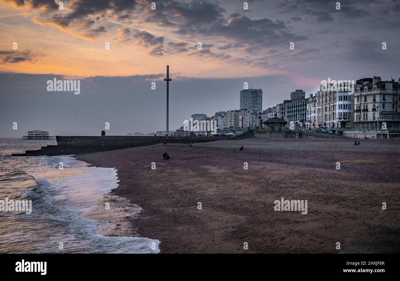 Dusk picture from Brighton Palace Pier,looking towards the old burnt out pier ruins, in Brighton, East Sussex, uk Stock Photo