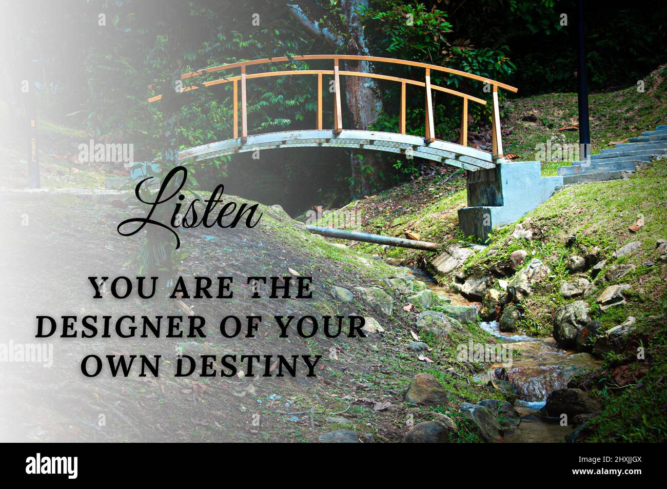Motivational quote - You are the designer of your own destiny. Waterfall and bridge background. Motivatonal concept Stock Photo