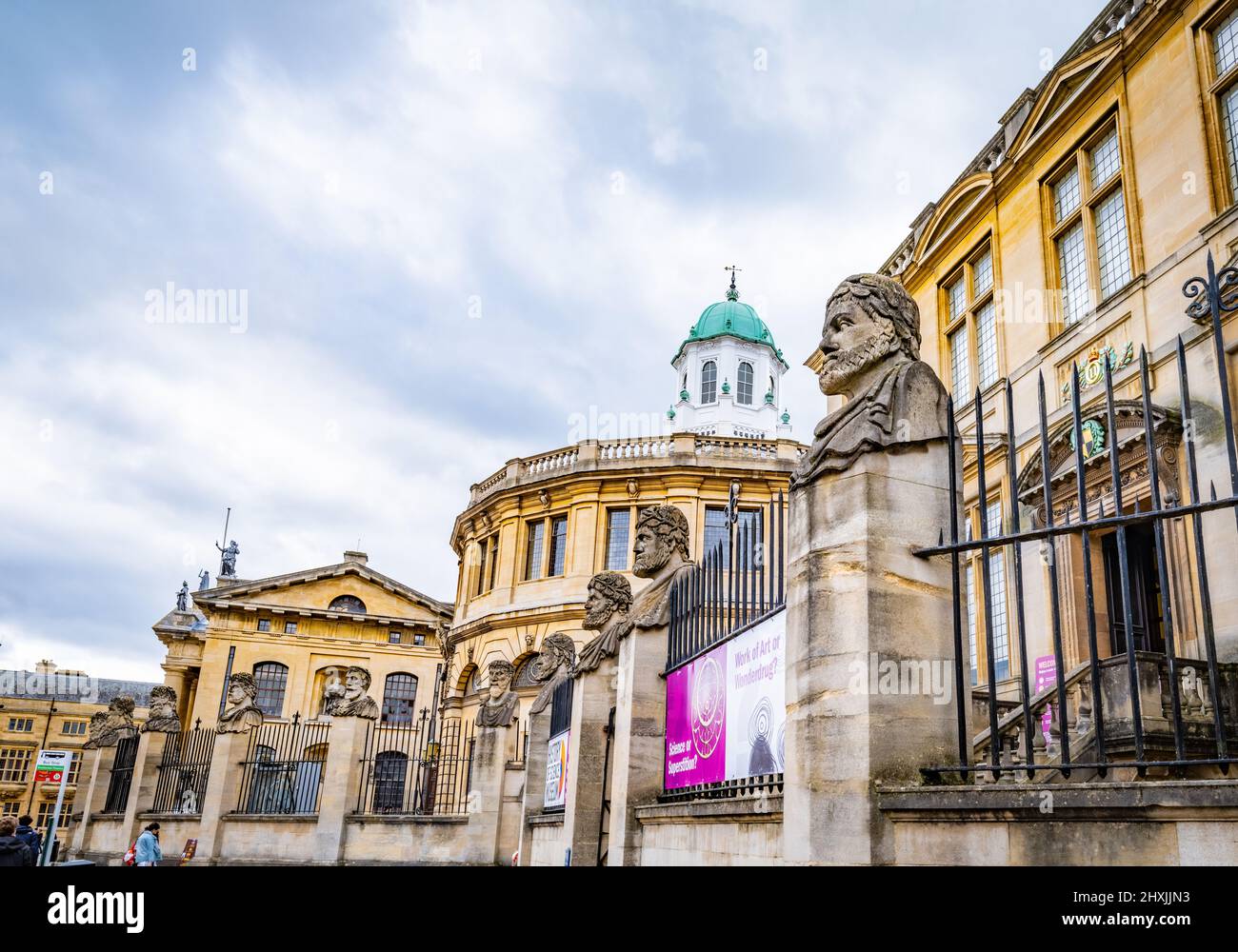 17 Sheldonian emperor heads infront of the History of Science Museum and the Sheldonian Theatre on Broad Street, Oxfor., The 17 stone heads depicting Stock Photo