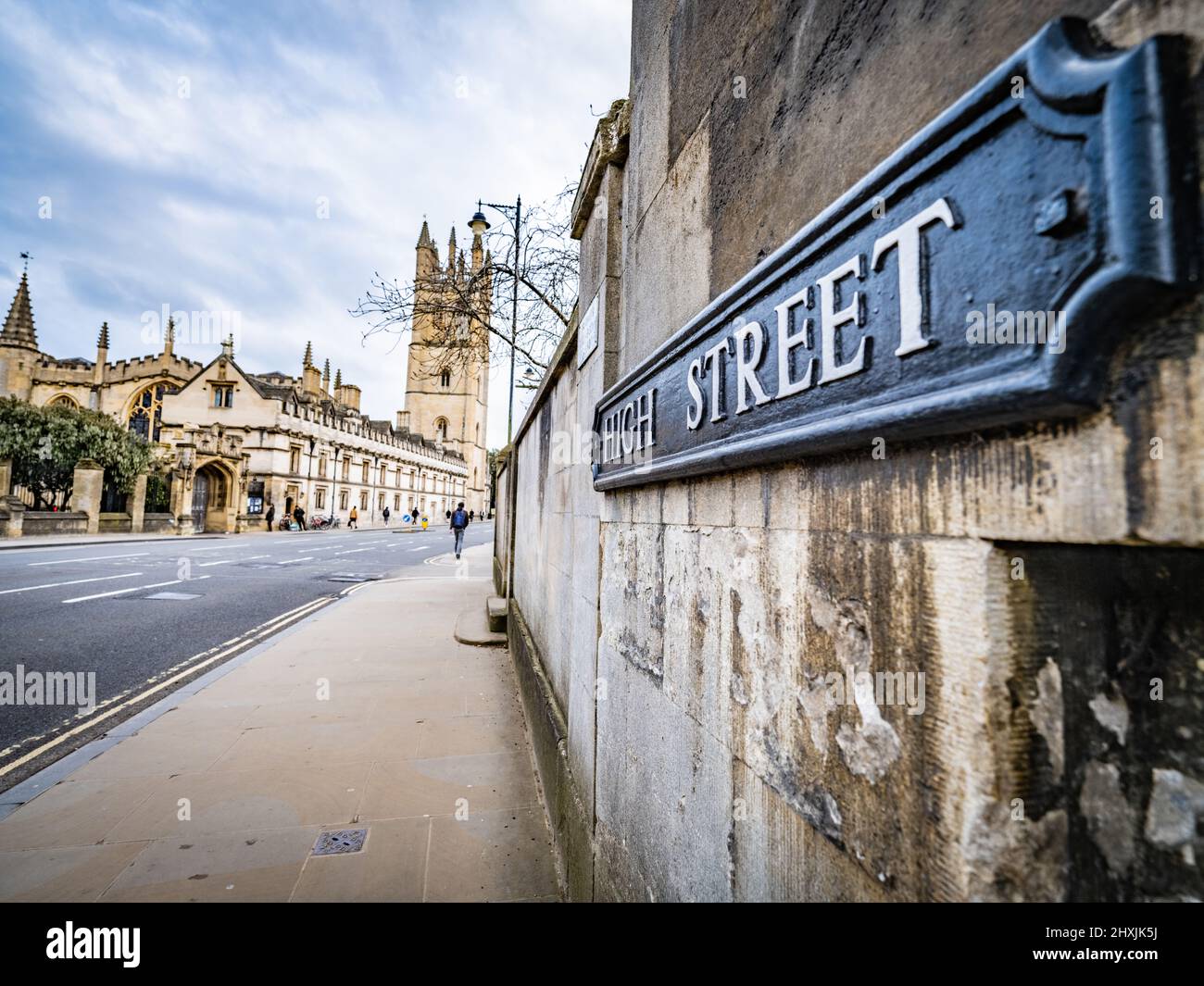 A sign of High Street, Oxford, with Magdalen Chapel, in the background, Oxford, Stock Photo