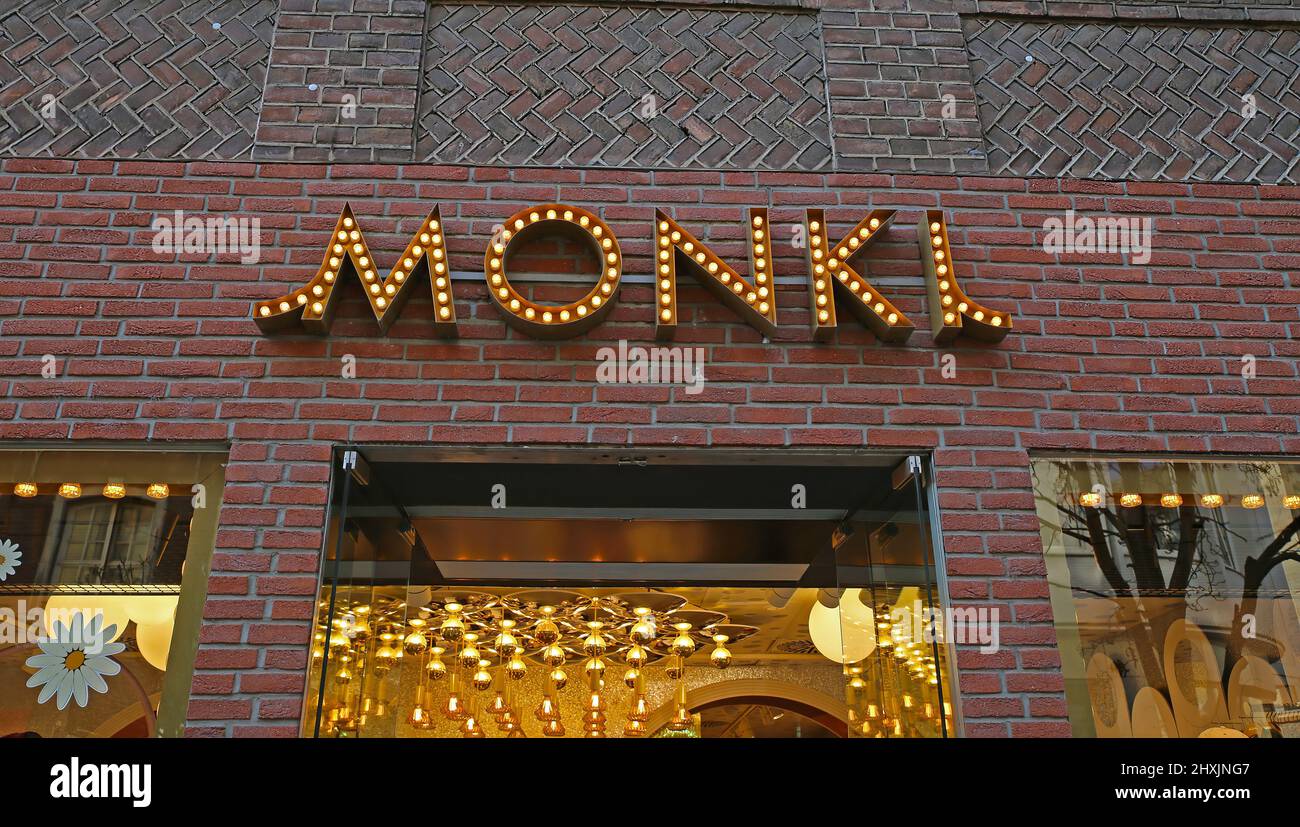 Düsseldorf, Germany - March 9. 2022: Closeup of logo lettering of monki fashion store over shop entrance Stock Photo