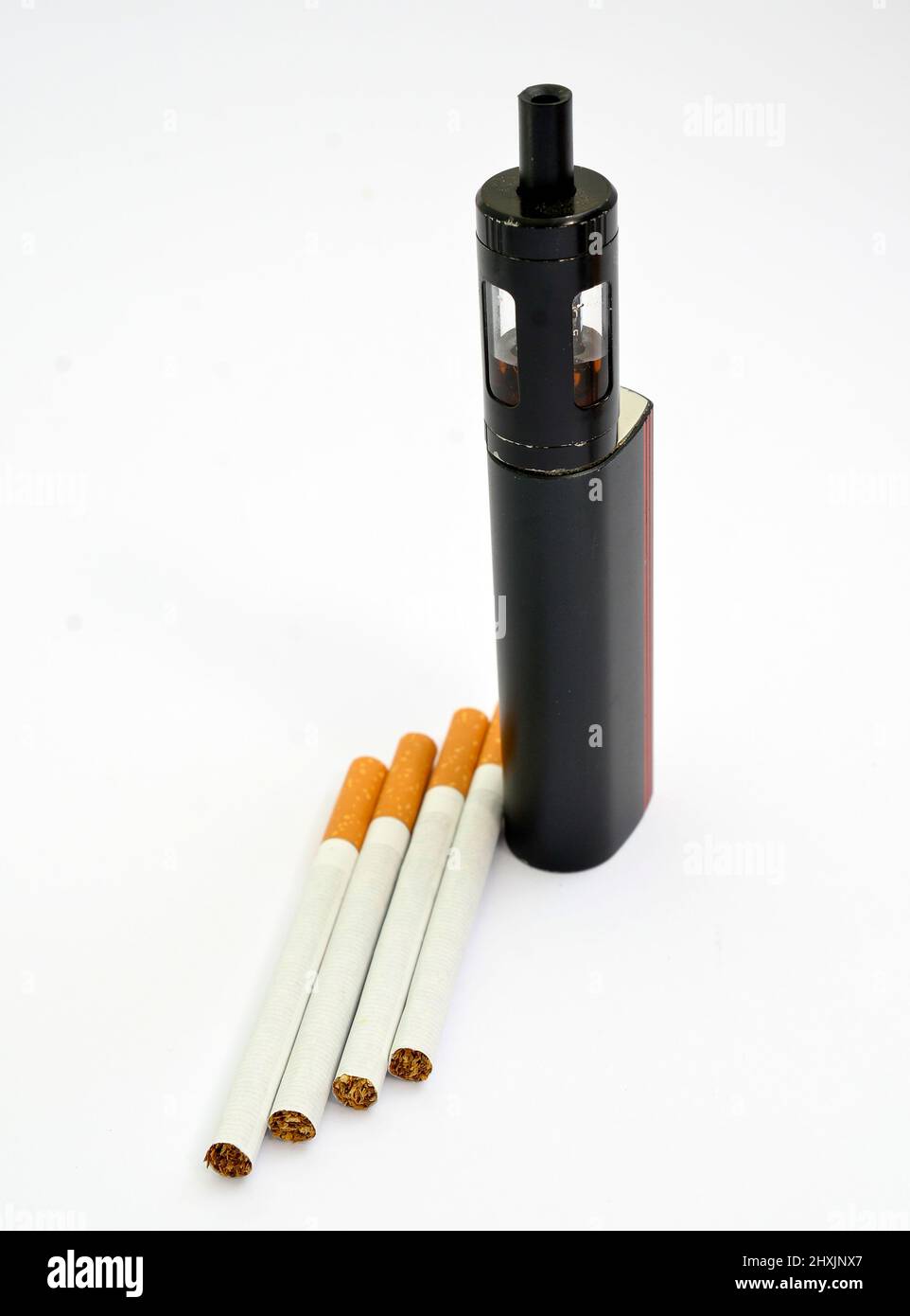 Vaping device, electronic cigarette and cigarettes white background. Stock Photo