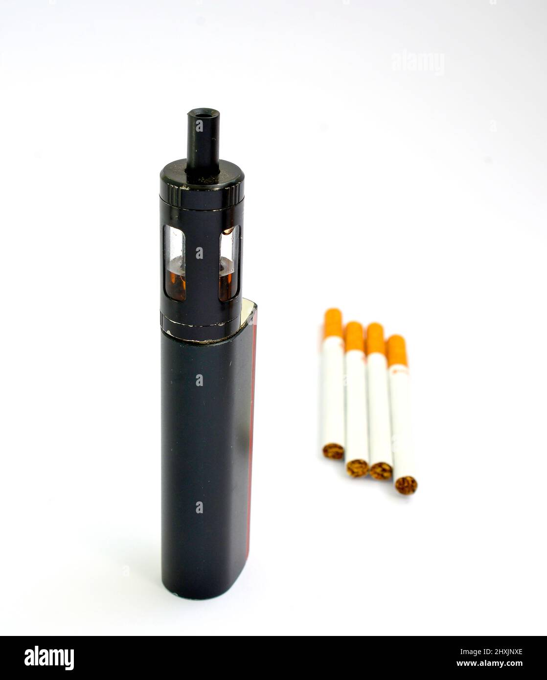 Vaping device, electronic cigarette and cigarettes white background. Stock Photo