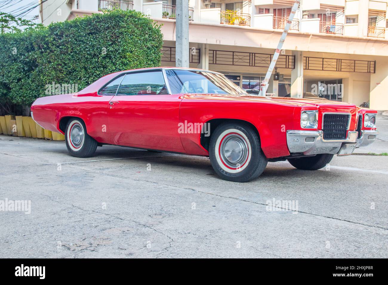 an American classic car in a parking lot in the city Stock Photo