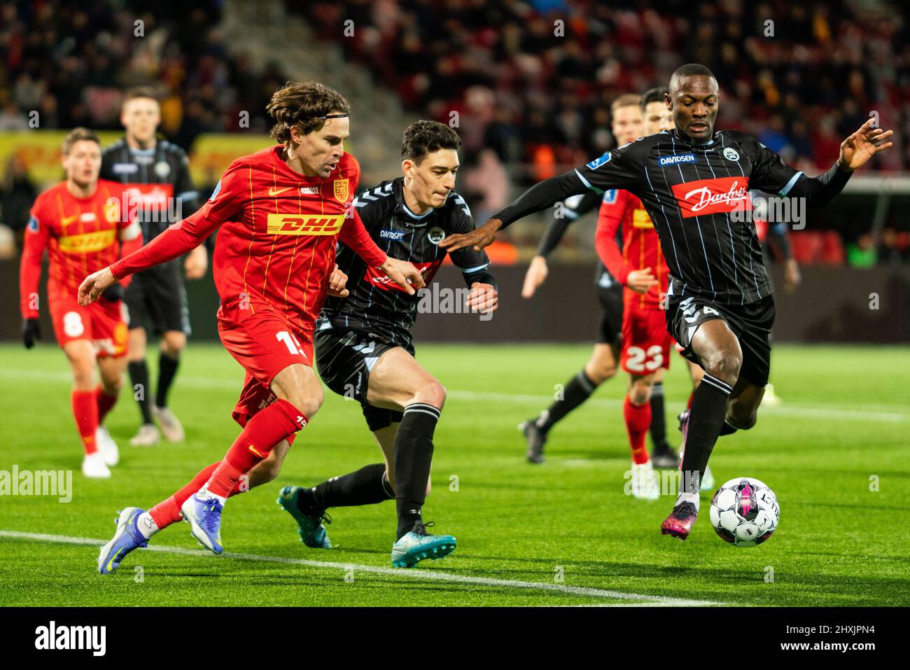 Farum, Denmark. 11th, March 2022. Duplexe Tchamba (4) and Maxime Soulas (12) of Soenderjyske seen in a battle for the ball with Erik Marxen (15) of FC Nordsjaelland during the 3F Superliga match between FC Nordsjaelland and Soenderjyske at Right to Dream Park in Farum. (Photo credit: Gonzales Photo - Gaston Szerman). Stock Photo