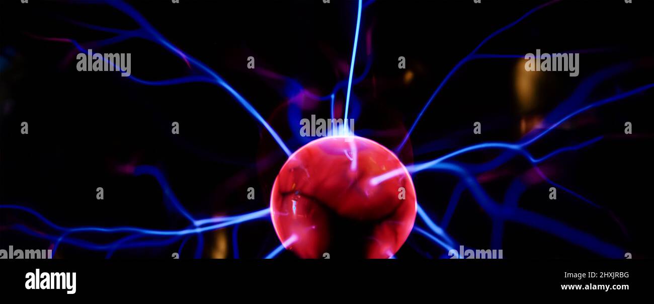 Plasma ball with energy rays on dark background, Physic model of plasma sphere Stock Photo