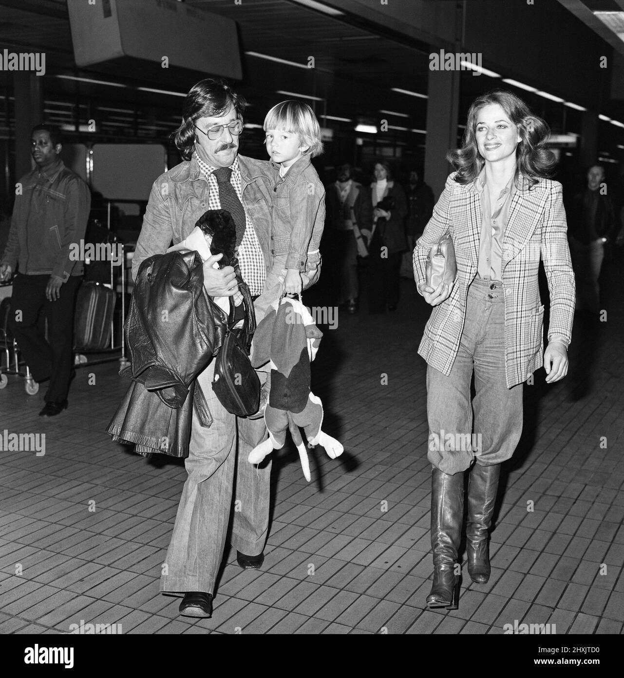 Charlotte Rampling at Heathrow Airport with her son Barnaby and husband Bryan Southcombe. 6th March 1976. Stock Photo