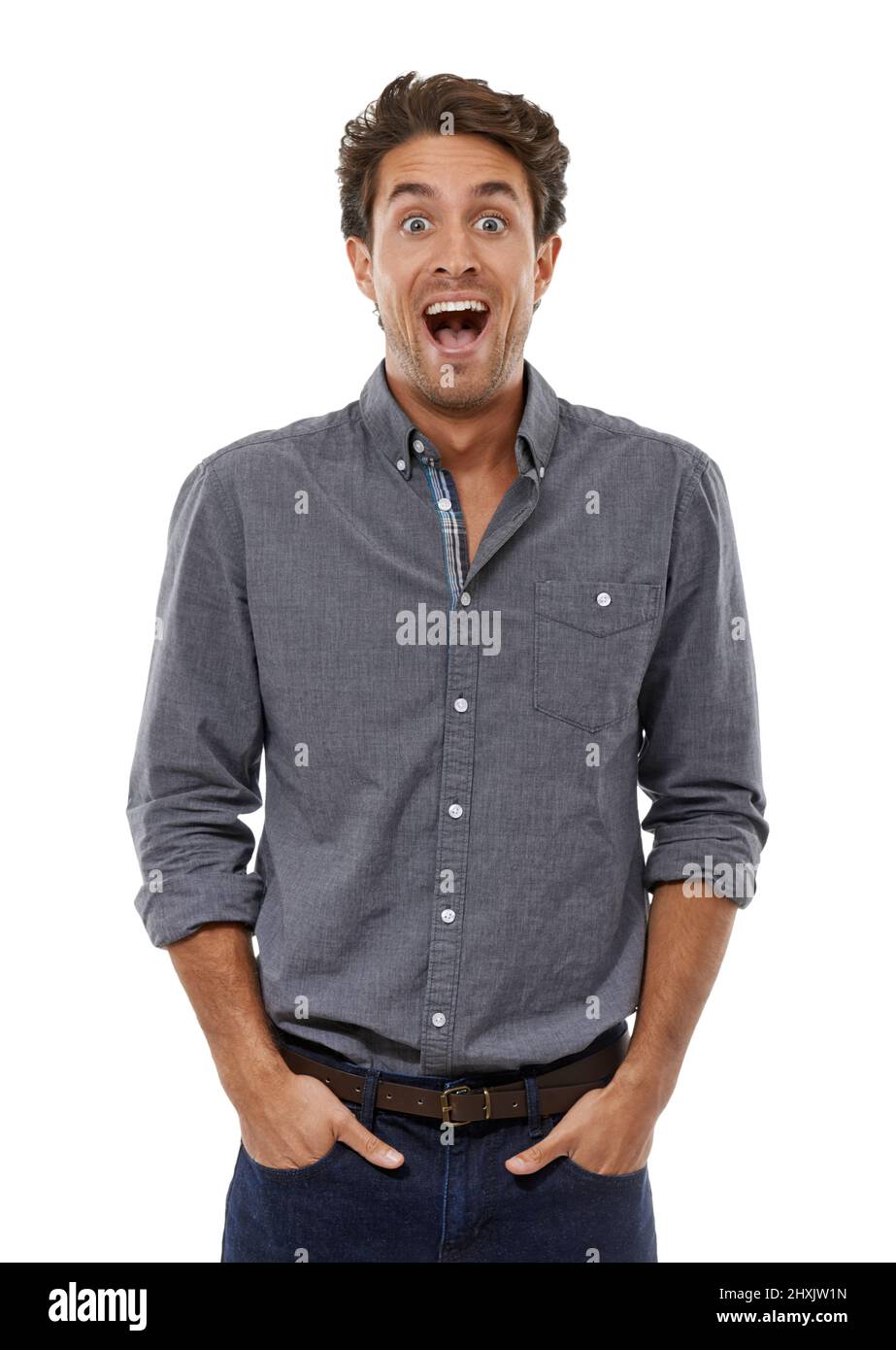 Oh my word. Portrait of a handsome young man looking shocked with his hands in his pockets. Stock Photo