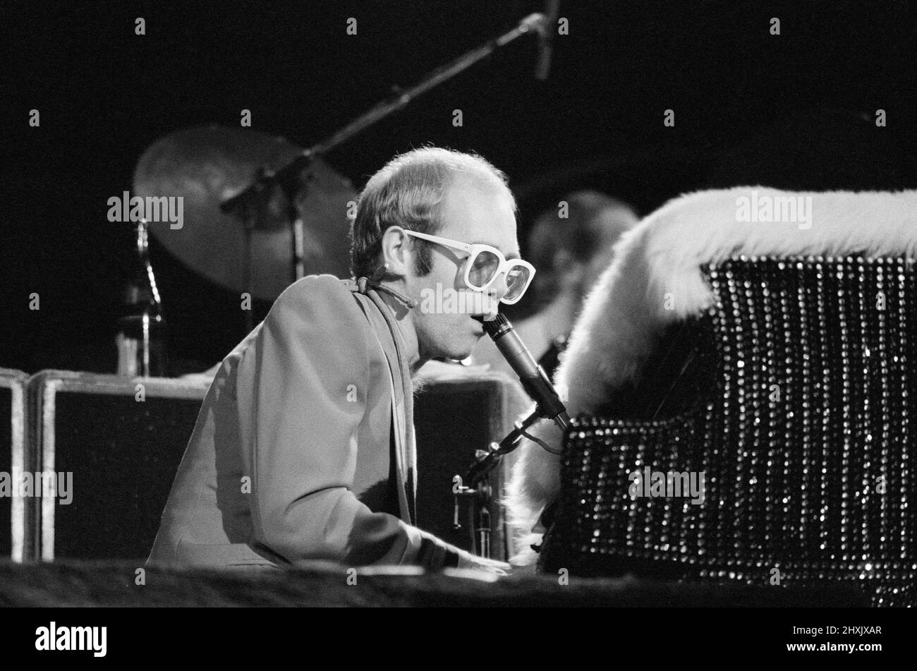 Pop star Elton John on stage at Earls Court, London. This is his first