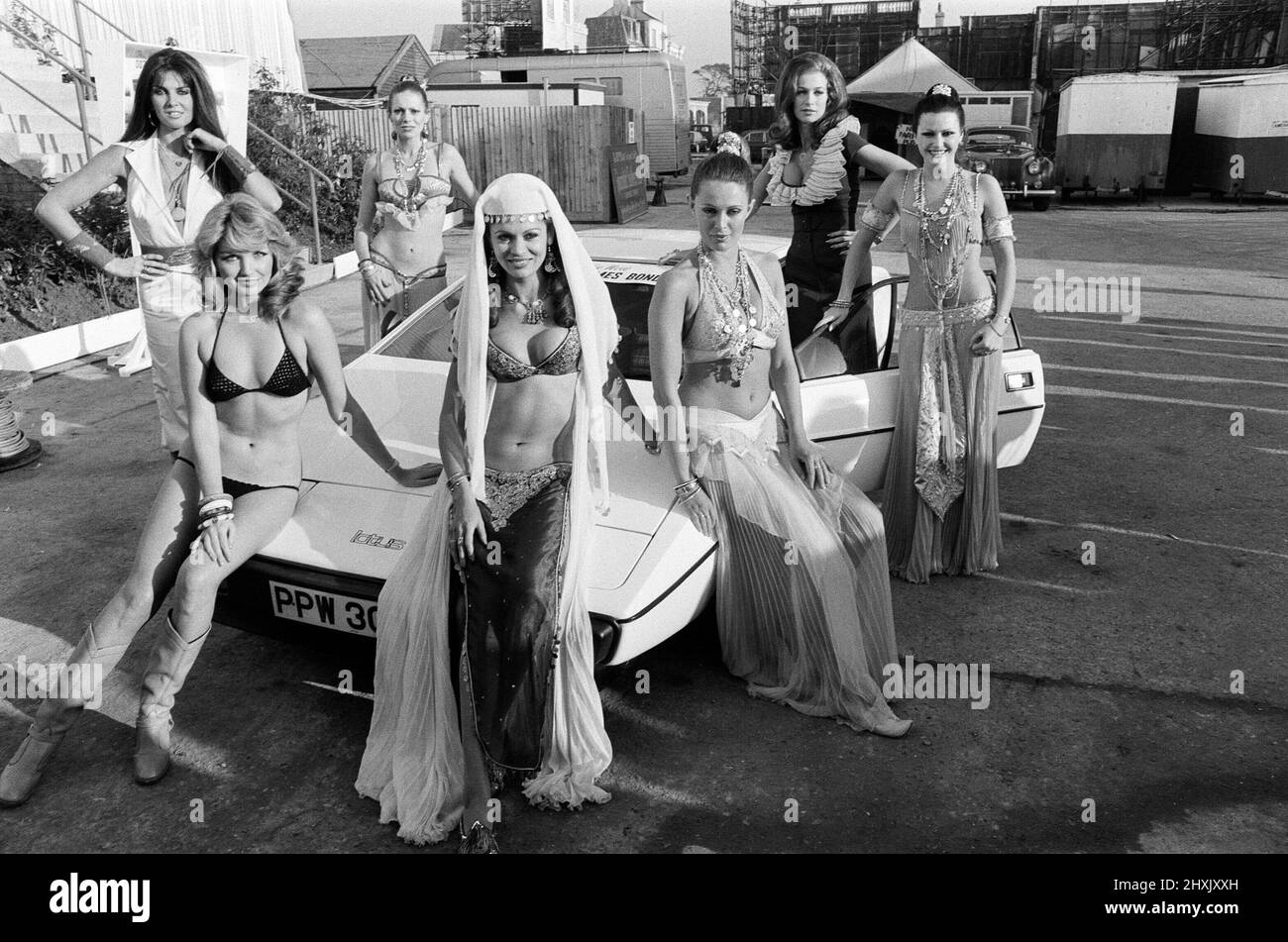Sir Harold Wilson visited Pinewood Studios to officially open the largest film stage in the world which was created for scenes featuring a super tanker and three submarines in the latest James Bond epic ' The Spy Who Loved Me'. Pictured are Bond girls (left to right) Caroline Munroe, Sue Vanner, Jill Goodall, Dawn Rodriques, Felicity York, Valerie Leon and Anika Pavel. 5th December 1976. Stock Photo