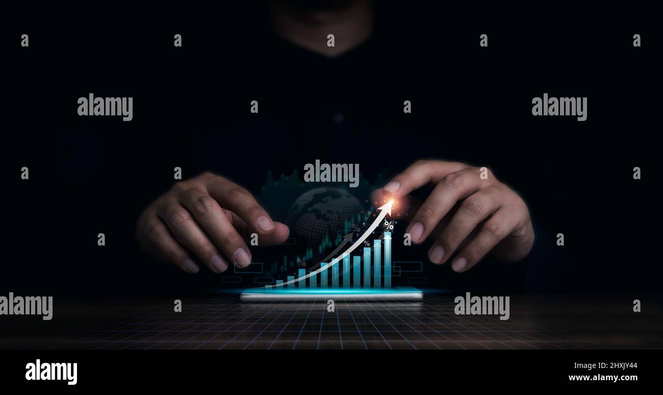 Investment technology, financial, ROI concepts. Increase arrow, exponential curve of progress in business performance over charts virtual on mobile ph Stock Photo