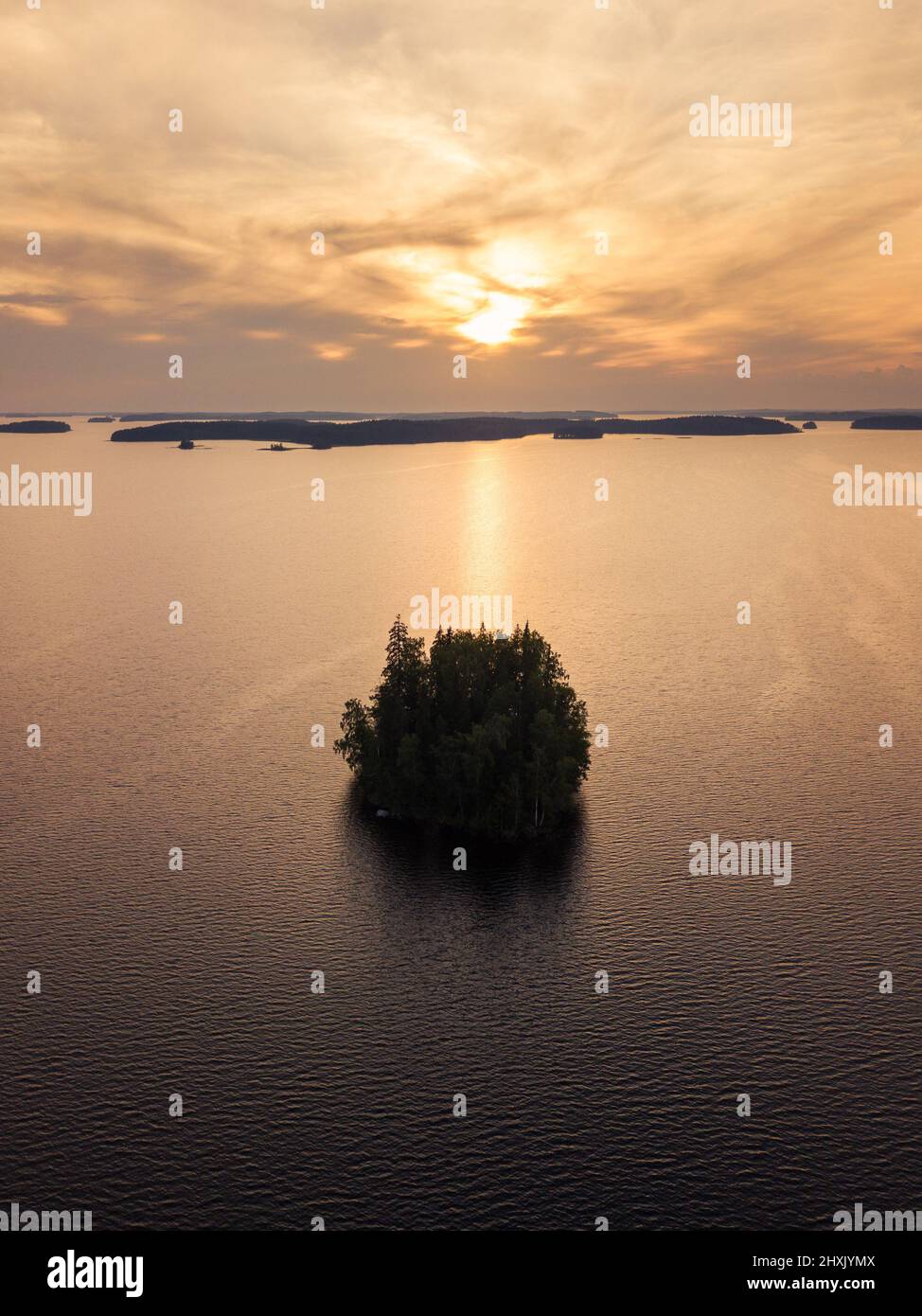 Island in lake landscape with beautiful sunset Stock Photo