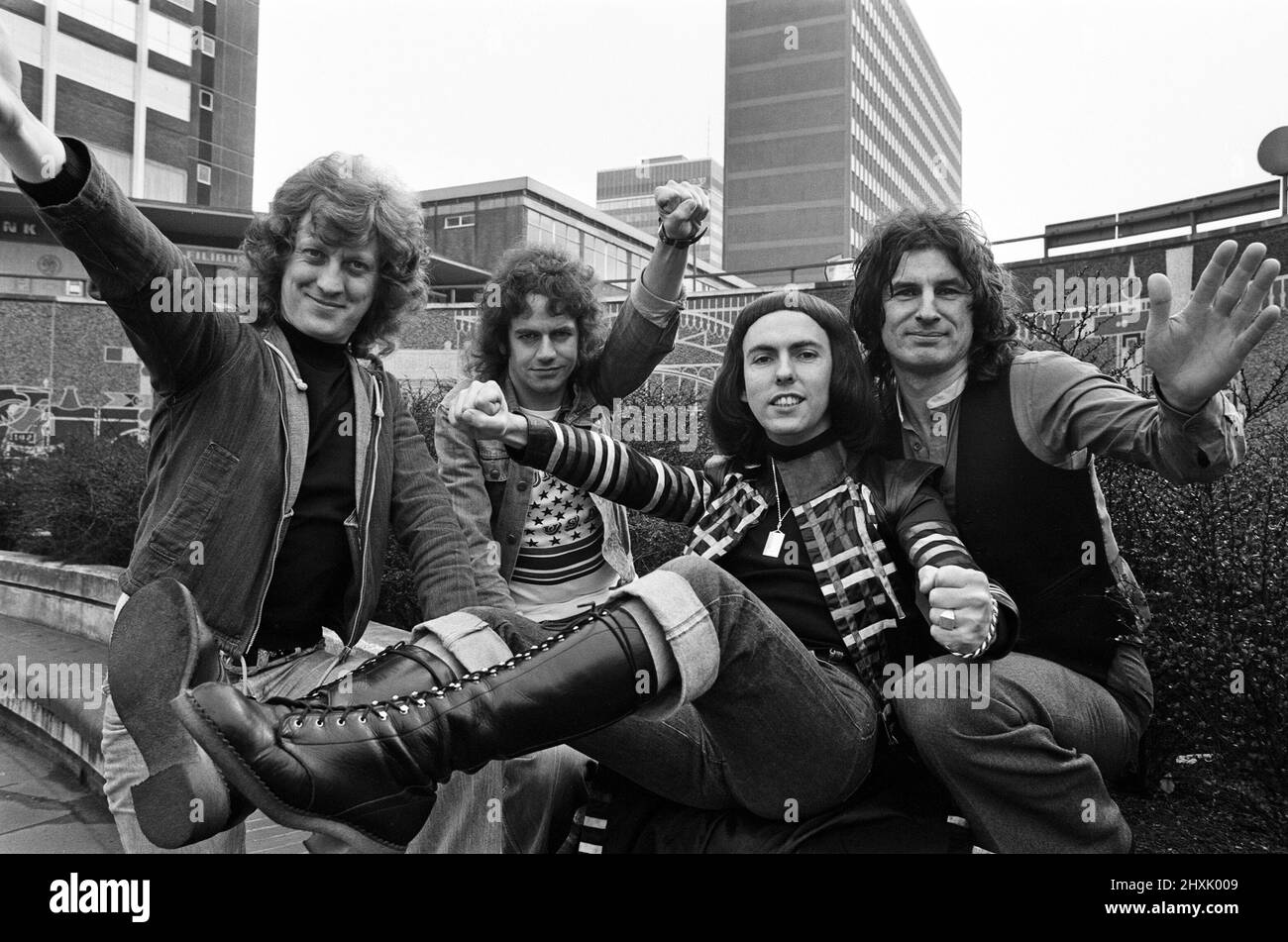 Glam rock group Slade posing for pictures in Birmingham City Centre