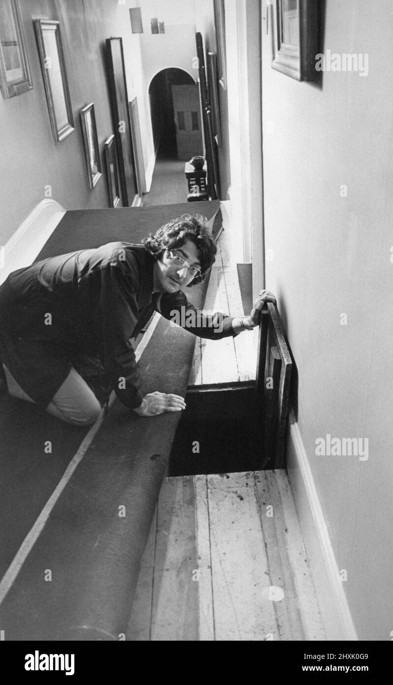 Lord Londonderry, 9th Marquess of Londonderry pictured at Wynyard Hall Estate, County Durham, 28th July 1977. Our Picture Shows ... Lord Londonderry looking at the uncovered passage under carpet found in Wynyard Hall last night. Stock Photo